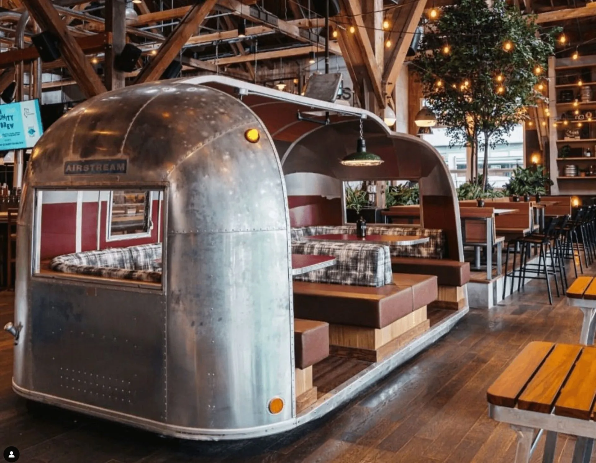 Restaurant seating built into a vintage aluminum trailer